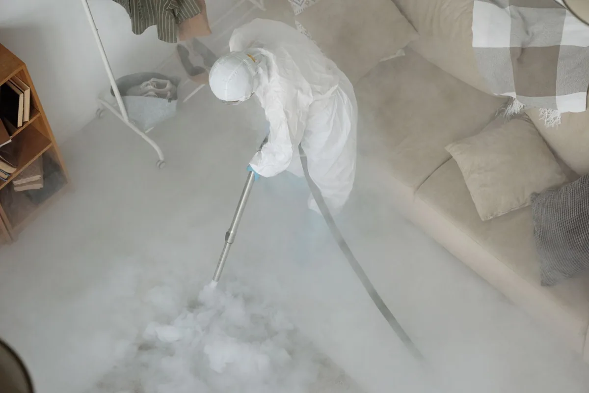 Biohazard cleanup technician in protective equipment, Baraga, MI